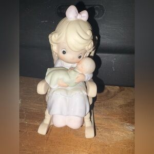 Precious Moments Figurine-Mother Cradling Baby.”Love Never Leaves a Mothers Arms